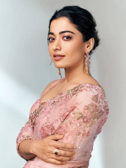 If pink is your colour, then this gorgeous floral-printed pastel pink saree draped by Rashmika Madanna can be your pick. 