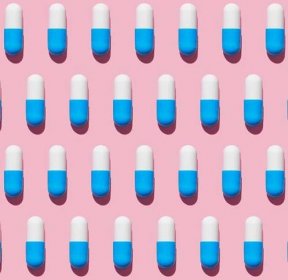 condition centers - Repeated pills on pink background