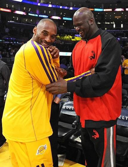 Former NBA player Shaquille O'Neal and Kobe Bryant #24 of the Los Angeles Lakers talk before the game against the Phoenix Suns at Staples Center on February 12, 2013 in Los Angeles, California. 