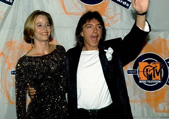 Susan Dey and David Cassidy smile backstage during the 1990 MTV Video Music Awards at the Universal Amphitheatre in Los Angeles, California, September 6, 1990. 