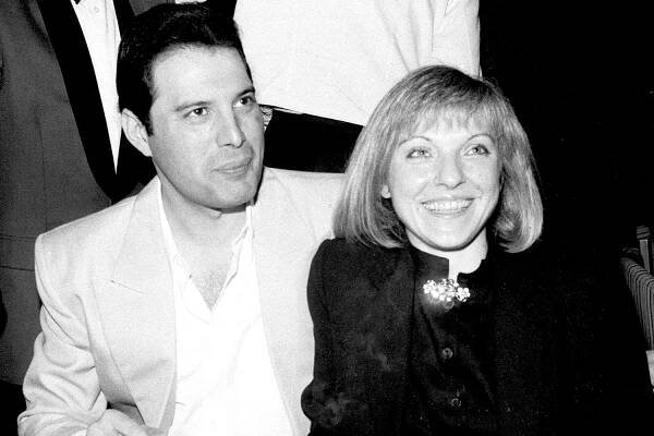 Freddie Mercury of Queen, winner of the Outstanding Contribution to British Music Award, pictured with Mary Austin on April 15, 1987 at the Ivor Novello Music Awards in London.