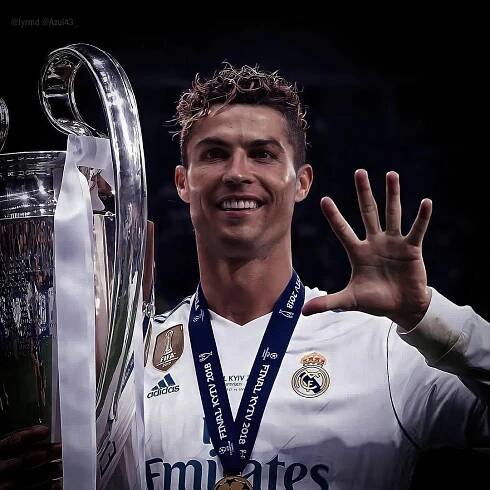 real madrid's cristianoo celebrates with the trophy