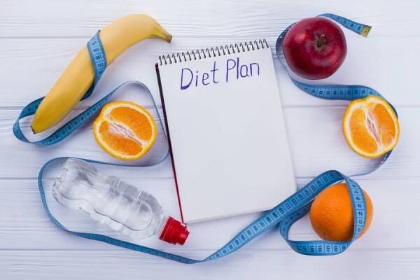 Poznámkový blok s nápisem dietní plán. — Stock obrázek