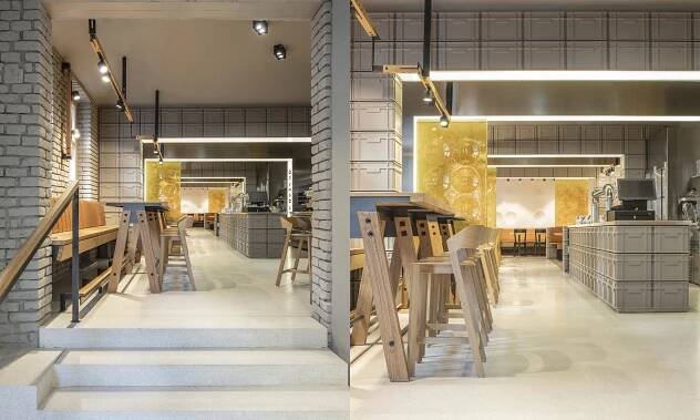 Na pražském Žižkově vyrostla restaurace Sou100 z šedých přepravek a zlatavého skla – DesignMag.cz