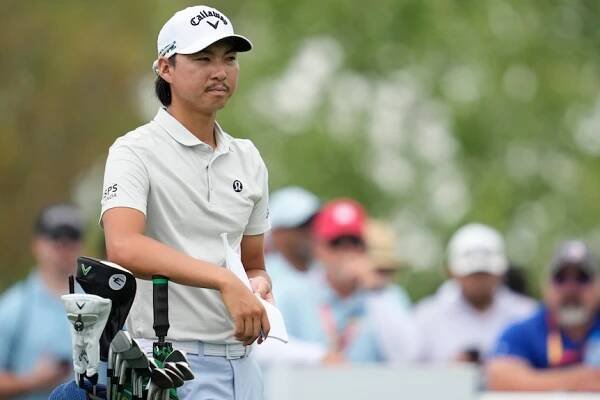 Min Woo Lee stands next to his bag at the Houston Open.