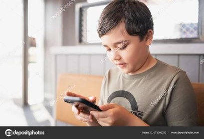 Download - Gen Z preteen school kid using learning app on smart phone Reading book online for school homework,Young boy browsing Internet,or social media for studying, Technology lifestyle — Stock Image