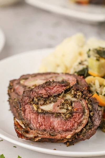 This amazing Italian Stuffed London Broil takes your everyday flank steak to the next level and beyond! From the marinade to the slow roasting, this recipe is a keeper!
