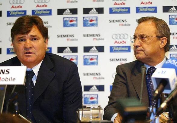 Real Madrid coach Jose Antonio Camacho speaks in a press conference alongside president Florentino Perez in September 2004.