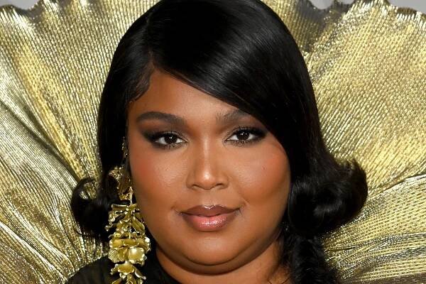 If You Missed the Brit Awards, Don't Miss Lizzo's Swoopy Bob and Massive Feather Clam Shell — See Photo