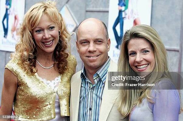 Actress Lynn Holly Johnson poses with former skater Scott Hamilton and wife Tracie as they arrive at the Walt Disney premiere of "The Ice Princess"...