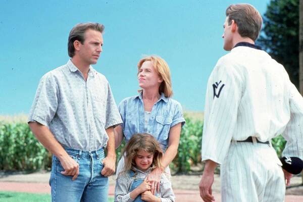 Kevin Costner as Ray Kinsella, Amy Madigan as Annie Kinsella, Gaby Hoffmann as Karin Kinsella, and Dwier Brown as John in 'Field of Dreams'
