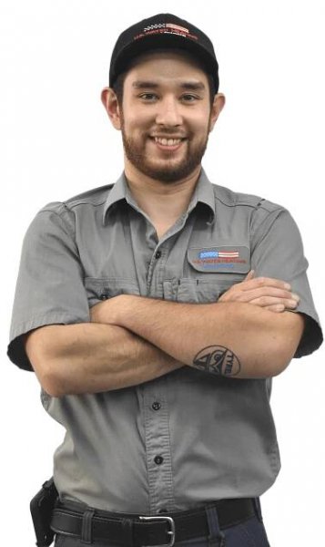 Illinois water heater repair technician, Seil, with arms crossed