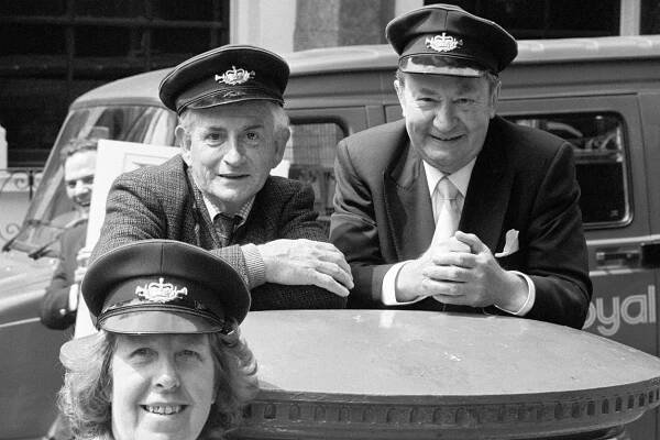 BBC stars Robert Fyfe (left), Peter Sallis (right) and Kathy Staff appearing in London to promote the launch of a Royal Mail guide to its postbus network in 1989