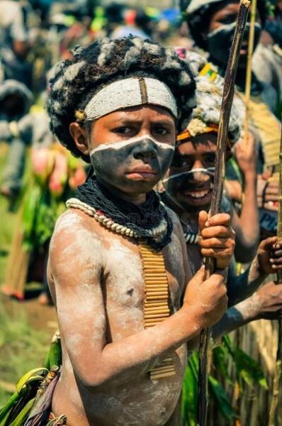 Wabag, Papua New Guinea - circa August 2015: Small native half-naked boy during traditional Enga cultural show in Wabag, Papua New Guinea. Documentary editorial. Wabag stock images, royalty-free photos and pictures