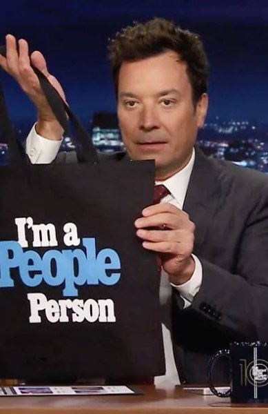 Jimmy Fallon holds up a 'I'm a People person' tote bag