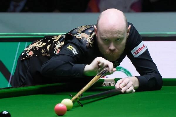 HONG KONG, CHINA – MARCH 04: Gary Wilson of England plays a shot in the first round match against Judd Trump of England on day 1 of the 2025 World Grand Prix at Kai Tak Arena on March 4, 2025 in Hong Kong, China. (Photo by Chen Yongnuo/China News Service/VCG via Getty Images)