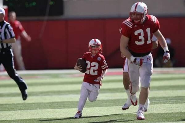 Jack Hoffman running in the University of Nebraska Stadium in 2013.