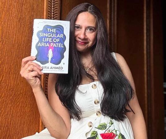Samira Ahmed holding her book, 'The Singular Life of Aria Patel'