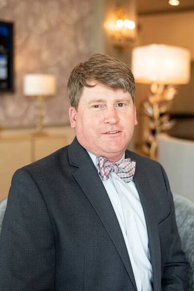 A portrait of Jason Burkhart managing director of operations