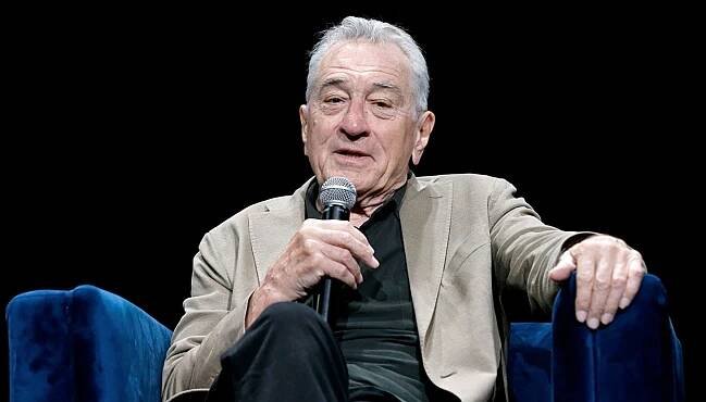 Robert De Niro speaks onstage with JR during the 2024 Tribeca Festival in 2024.