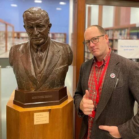 The author next to a bust of Thomas J. Watson