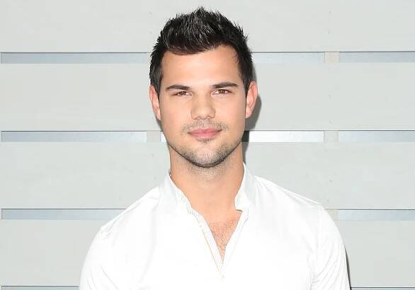 Newly engaged actor Taylor Lautner wears a white shirt