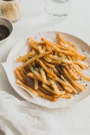 Furikake fries on a paper-lined plate.