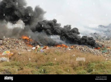 Burning garbage , Landfill , waste dumping ground , Deonar , Bombay , Mumbai , Maharashtra , India , Asia Stock Photo