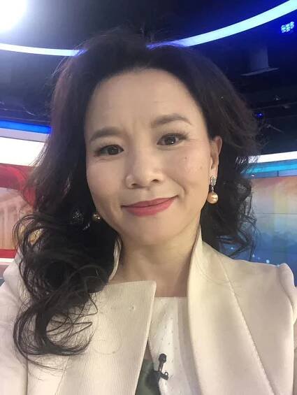 Australian journalist Cheng Lei poses for a selfie in this undated handout photograph