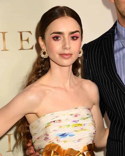 Lily Collins with a fluorescent pink halo eye makeup look