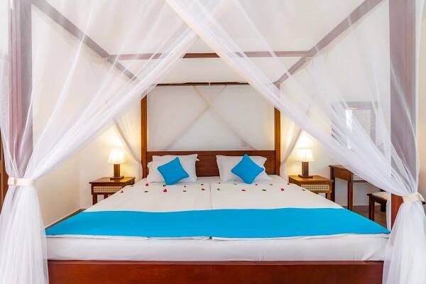 Postel nebo postele na pokoji v ubytování Diani Sea Lodge - All Inclusive
