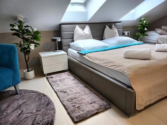 Postel nebo postele na pokoji v ubytování Wellness Apartmány EMPORIO