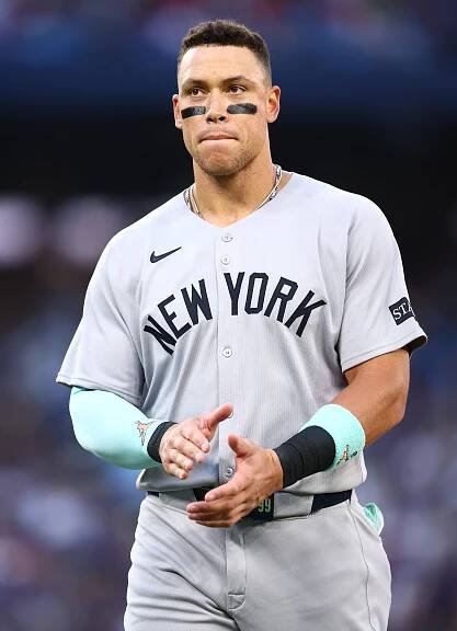 Aaron Judge #99 of the New York Yankees reacts after popping out in the fifth inning during the game against the Toronto Blue Jays at Rogers Centre on July 21, 2025.