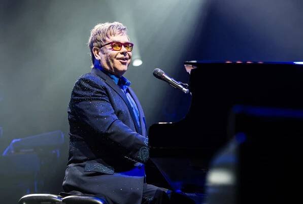 PARIS, FRANCE - DECEMBER 09: Sir Elton John performs at L'Olympia on December 9, 2013 in Paris, France. (Photo by David Wolff - Patrick/Redferns via Getty Images)