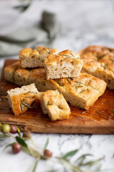 Cut up pieces of easy no-knead focaccia bread