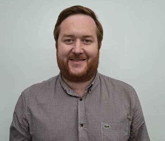 Headshot of Rhys Brennan