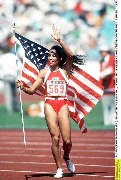 Florence Griffith Joyner running the track with American flag in Seoul