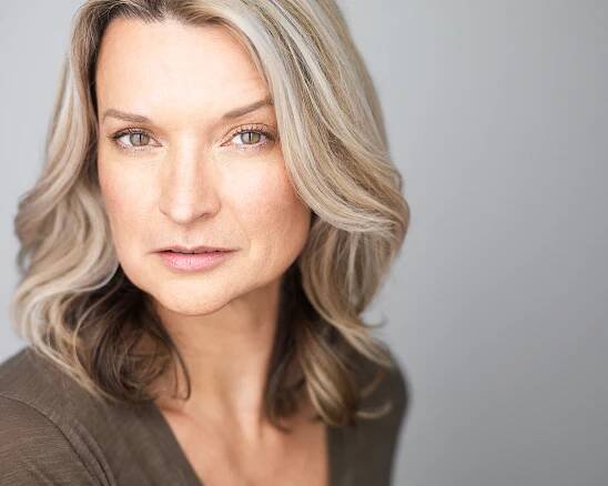 Andrea Powell headshot brown shirt