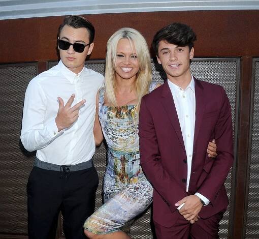 Pamela Anderson, 58, and Liam Neeson, 73, both share special bonds with their sons and can connect over being single parents - as the pair spark fresh romance rumours (Pamela pictured with children Brandon Thomas and Dylan Jagger)