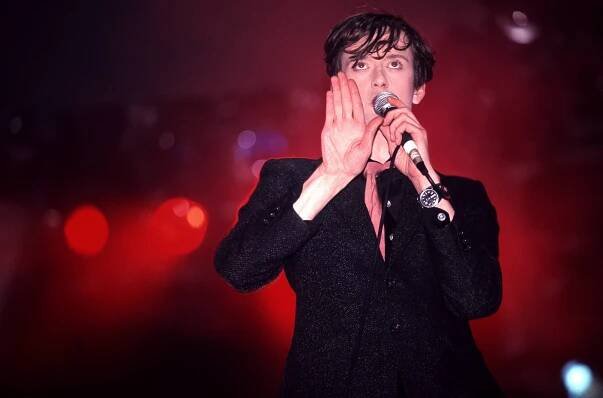 Jarvis Cocker performing at Glastonbury in 1995