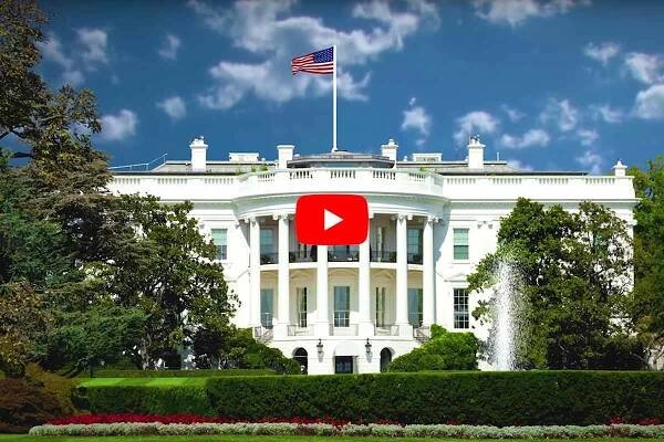 picture of the back of The White House in Washington DC with a play button symbol over the top 2