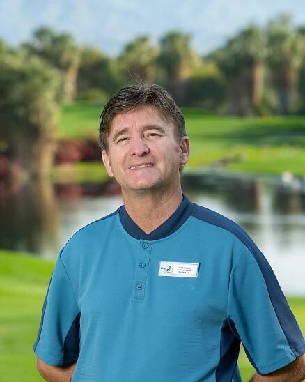 Contact section of the Palm Desert Golf Academy webpage featuring Paul Bucy, Director of Instruction, with his photo, phone number, email address, and location at Desert Willow Golf Resort in Palm Desert, California.