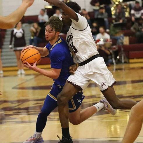 Lance Brinegar drives by a defender. /Danielle Scott • The Brand