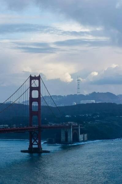 Free A stunning view of the Golden Gate Bridge against a dramatic sky in San Francisco, California. Stock Photo