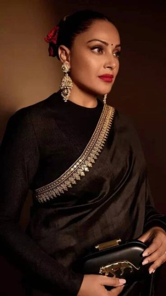 Bipasha Basu captivates in a timeless black satin saree