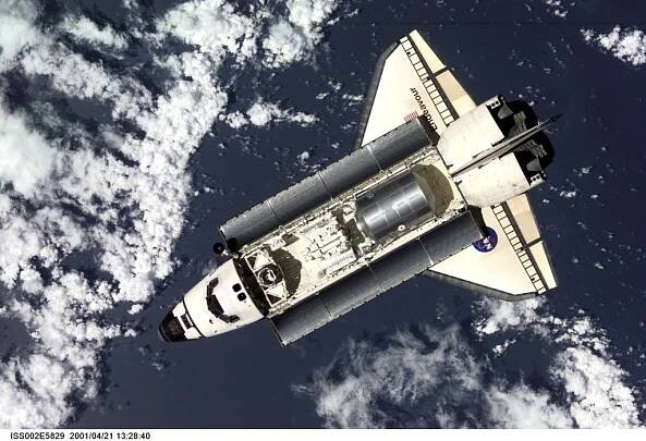 The Space Shuttle Endeavour, with six astronauts and a cosmonaut onboard, approaches the International Space Station (ISS) for an April 21 docking. The photo was taken with a digital still camera by one of the three Expedition Two crew members onboard the Station.