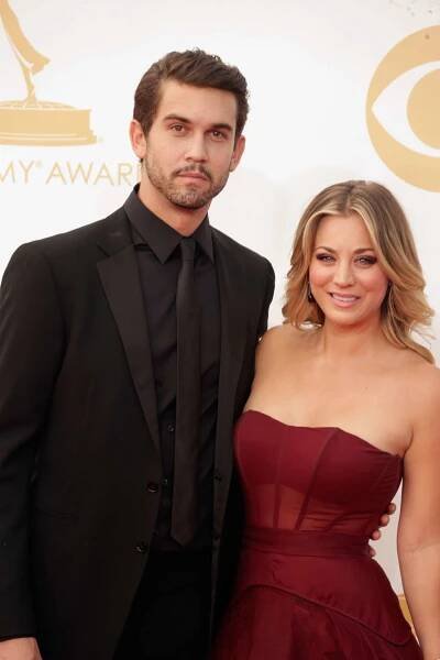 Kaley Cuoco and Ryan Sweeting in formalwear posing together at the Emmy Awarads