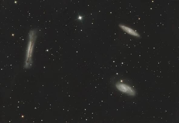 The Leo Triplet (also known as the M66 Group) is a small group of galaxies about 35 million light-years away in the constellation Leo. This galaxy group consists of the spiral galaxies M65, M66, and NGC 3628.