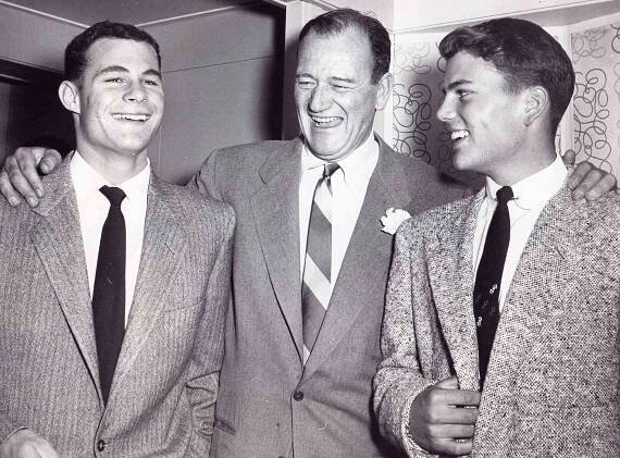 John Wayne with his sons Michael and Patrick Wayne. 