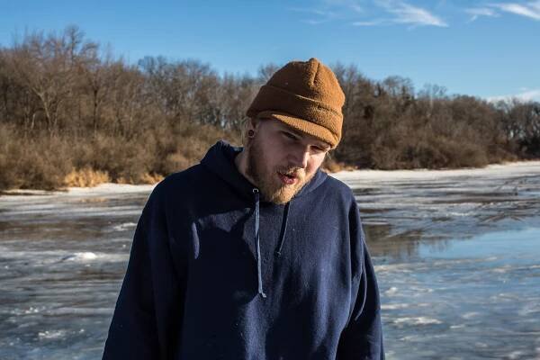  Jesse Smith ice fishing at Briggs Woods pond on Sunday, January 19, 2014, in Webster City, IA. 